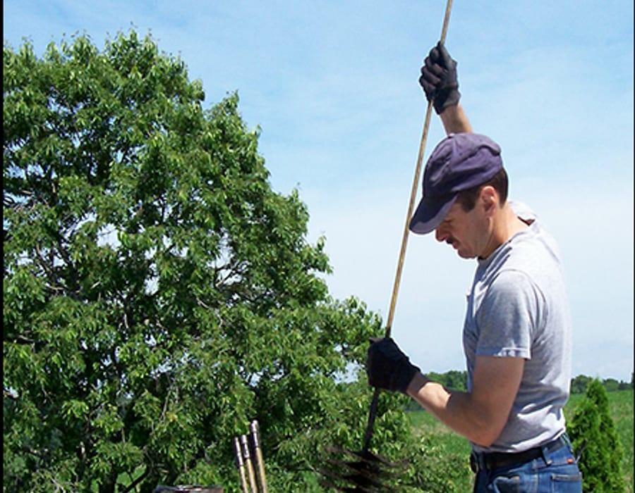 Dr. Chimney Sweep technician on the job